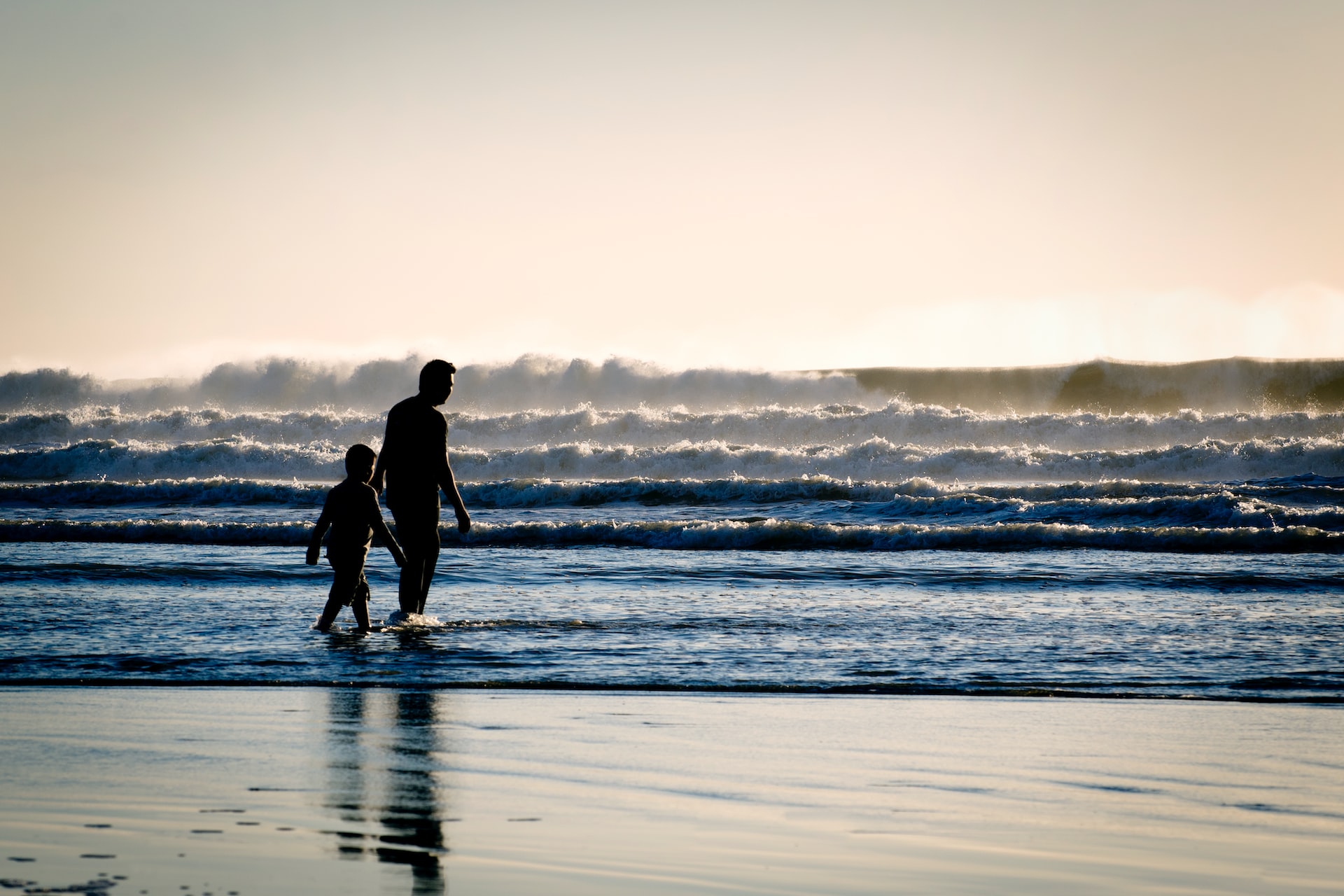 Father Son walking near sea shore